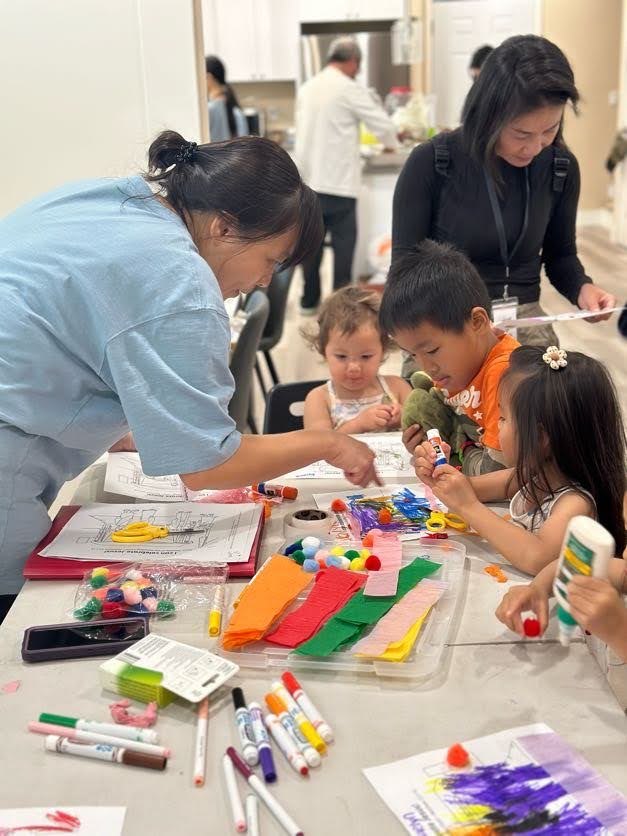 Children and adult leaders participating in a colorful craft activity